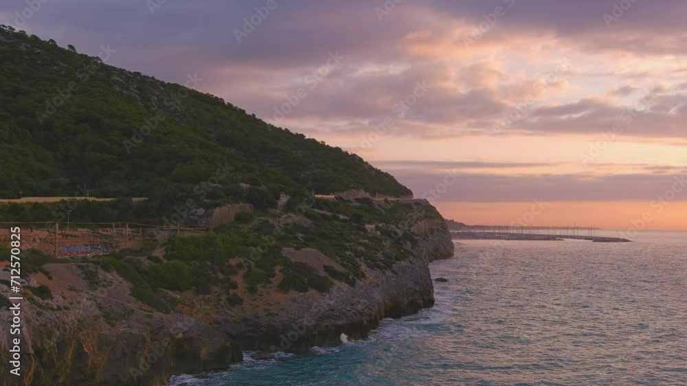 Aerial view along Costa del Garraf at dawn. View of Coast and Puerto Ginesta Aerial view along Costa del Garraf at dawn. View of Coast and Puerto Ginesta