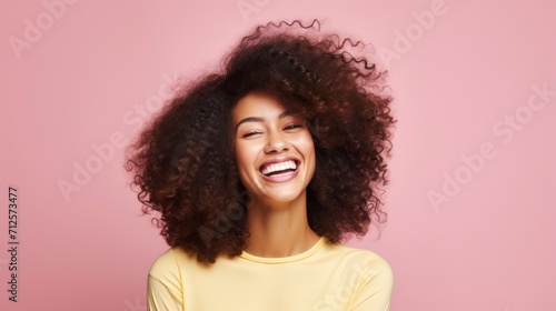 Young woman with afro hairstyle smiling at camera