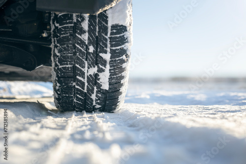 Car tires on snow covered road in winter © Brian Jackson