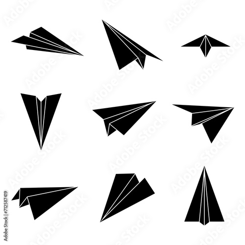 Set simple paper planes black icon. White origami paper airplanes from different angles. Handmade aircraft on white background. Vector illustration