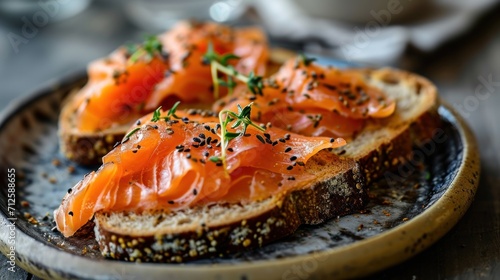  a close up of a plate of food with bread and salmon on it with sprigs of seasoning.