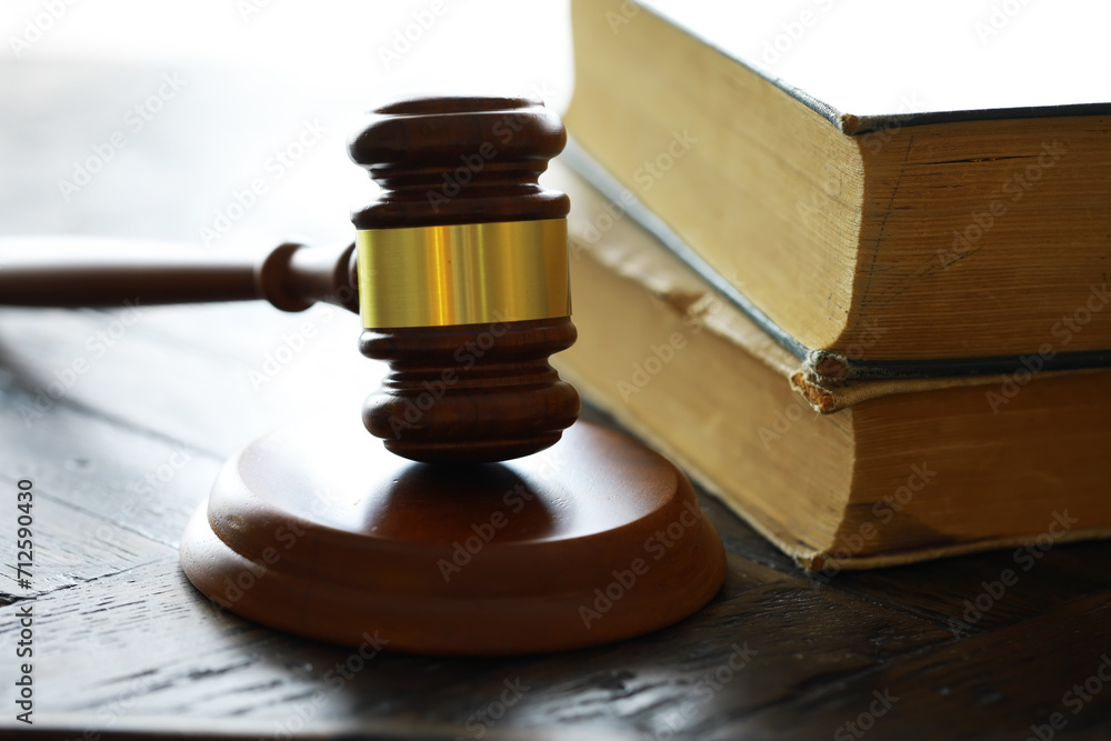 Obraz premium Judges gavel on wooden desk. Law firm concept.