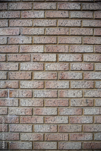 Modern beige brick wall background texture. Home and office interior design backdrop. 