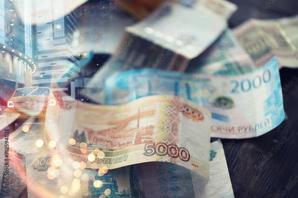 Russian money. Different denomination of bills. Finance concept. Double exposure city. - obrazy, fototapety, plakaty 