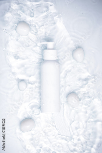 Beauty product bottle with a fresh water theme background.