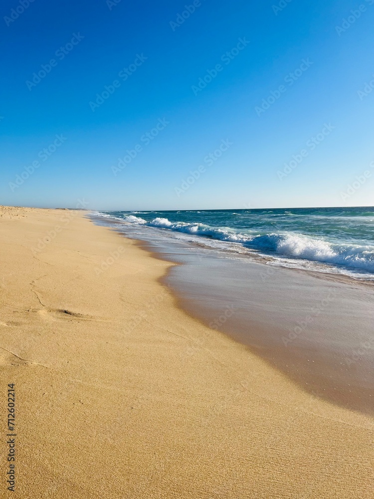 Sand beach, sea coastline, pure blue sky, natural seascape background, no people