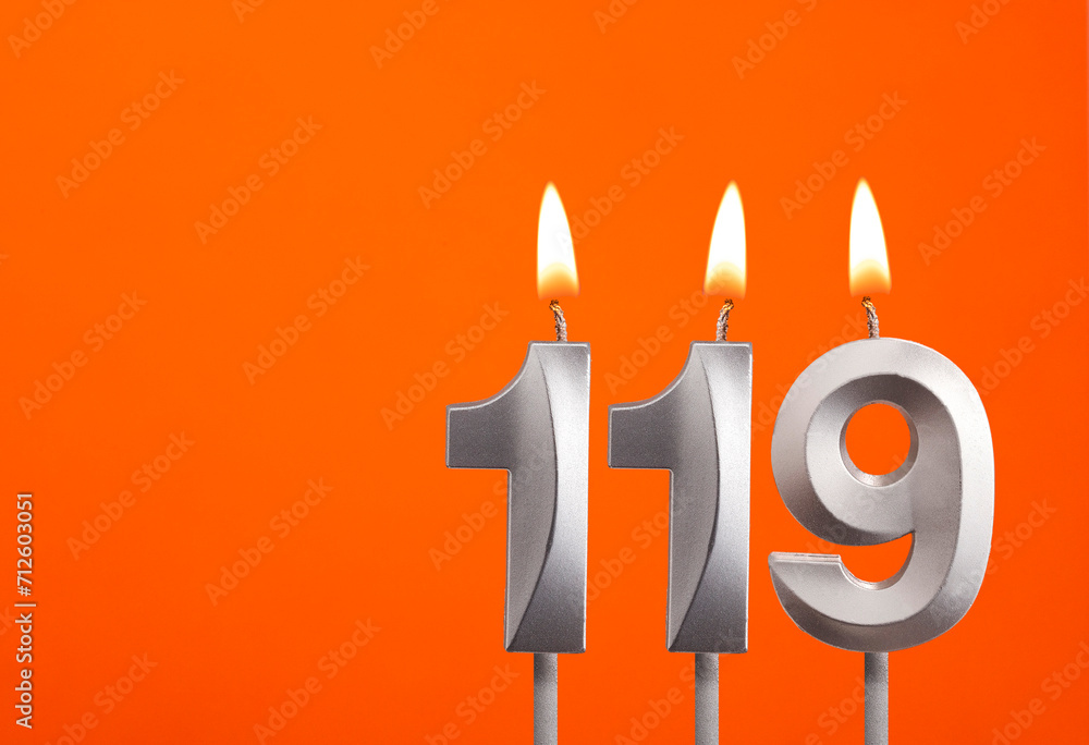 Candle number 119 - Birthday in orange background Candle number 119 - Birthday in orange background
