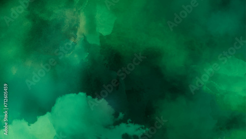 Dark green watercolor background with clouds effect. 