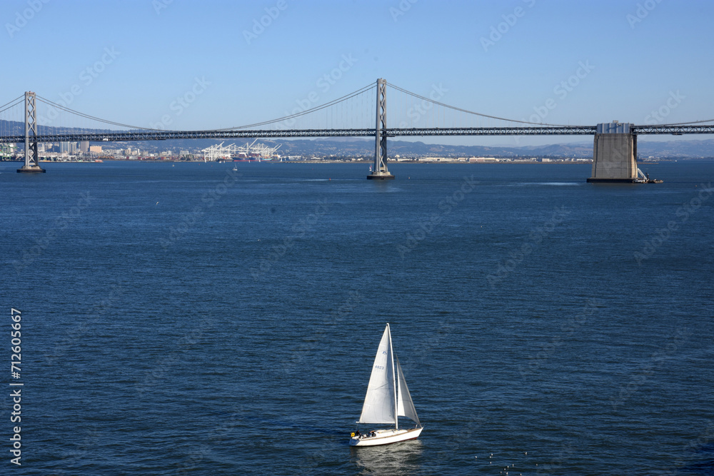 San Francisco Oakland Bay Bridge and sailing yacht San Francisco Oakland Bay Bridge and sailing yacht