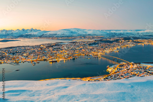 Fototapeta Naklejka Na Ścianę i Meble -  Norway- Troms og Finnmark- Tromso- long exposure of illuminated city seen from Fjellheisen at sunset