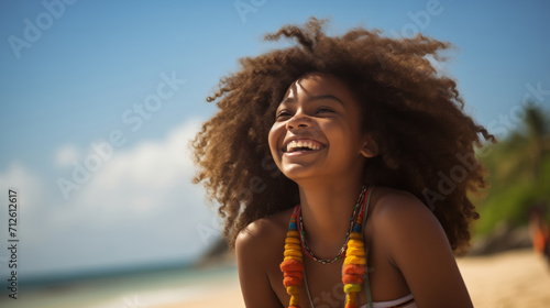 An african american teenage girl happily enjoying herself on a sunny beach during a warm day. girl on the beach in the summer. travelling alone concept, happy moment. 