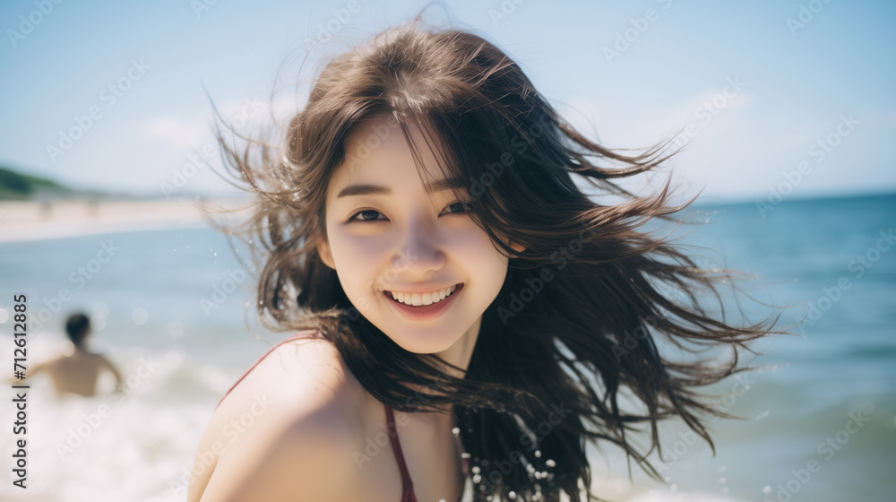 An asian teenage girl happily enjoying herself on a sunny beach during a warm day. girl on the beach in the summer. travelling alone concept, happy moment. An asian teenage girl happily enjoying herself on a sunny beach during a warm day. girl on the beach in the summer. travelling alone concept, happy moment.