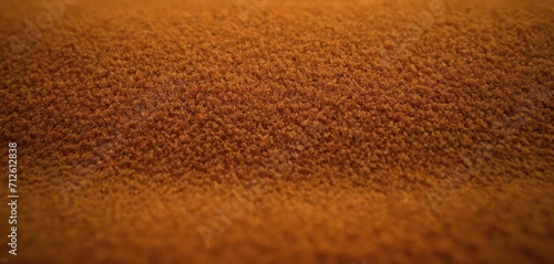  a close up of a brown carpet with a small amount of light coming from the top of the carpet and a small amount of light coming from the bottom of the carpet.
