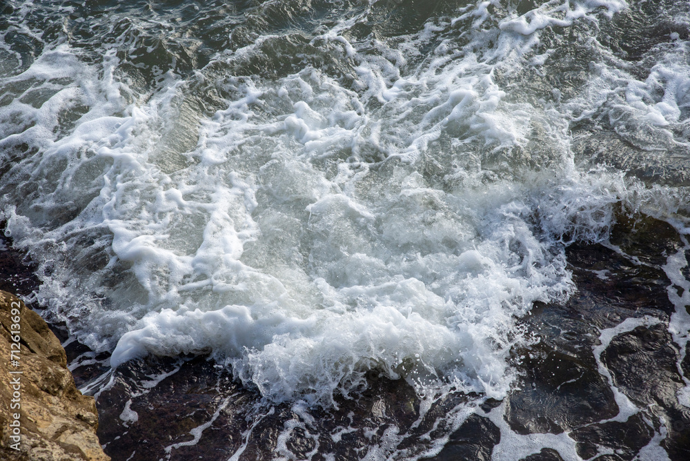 Mediterranean sea waves. Waves crashing on rocks