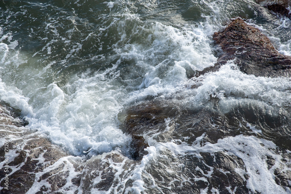 Mediterranean sea waves. Waves crashing on rocks