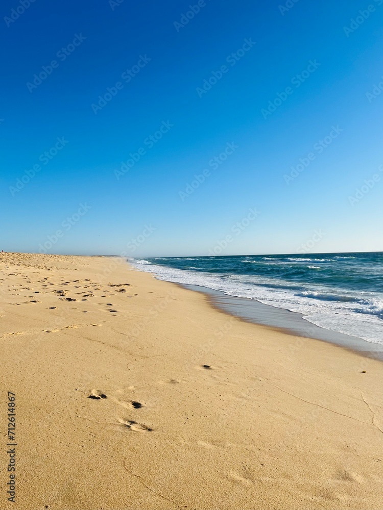 Sand beach, sea coastline, pure blue sky, natural seascape background, no people Sand beach, sea coastline, pure blue sky, natural seascape background, no people