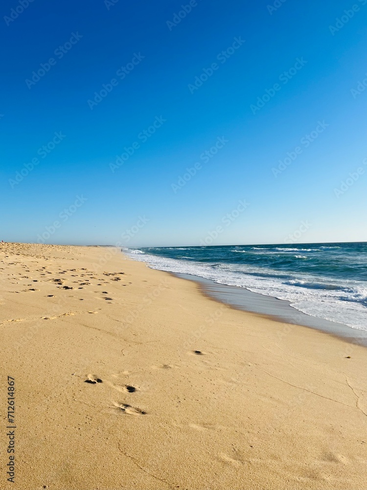 Sand beach, sea coastline, pure blue sky, natural seascape background, no people