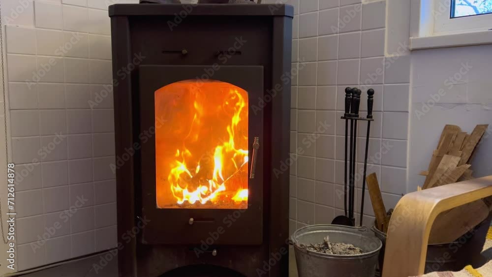 a fire is burning in a metal stove at the cottage video a fire is burning in a metal stove at the cottage video