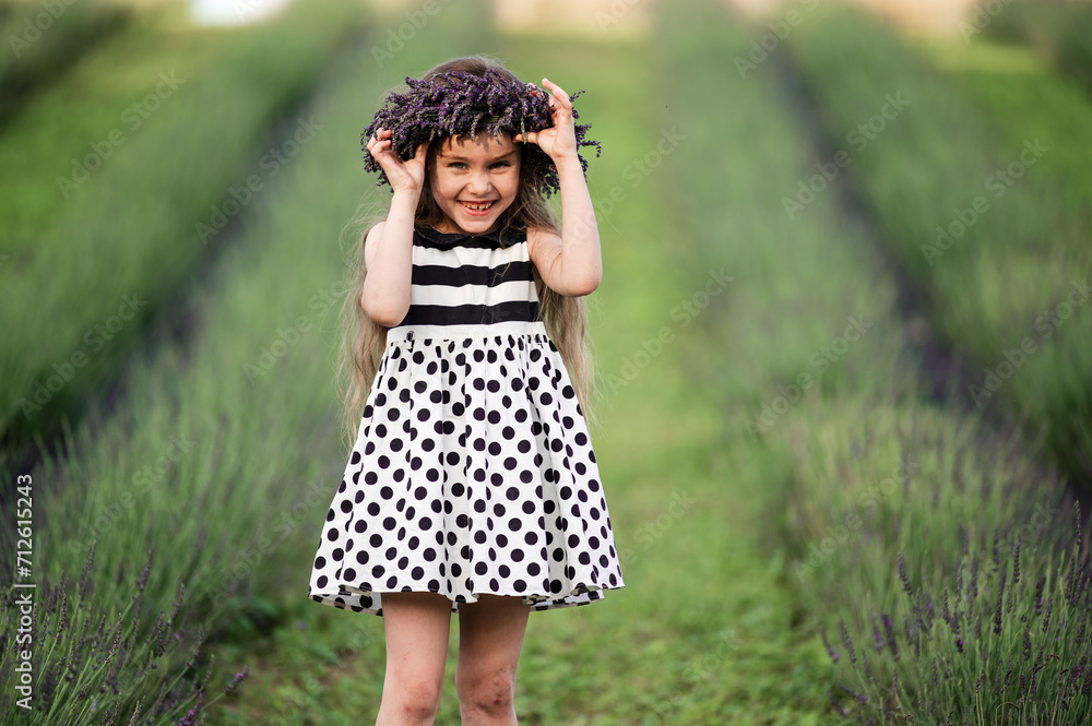 a cute little girl is smiling and fixing her crown that flew off her head a cute little girl is smiling and fixing her crown that flew off her head