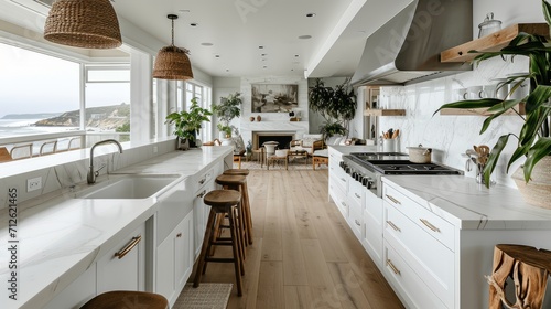 coastal interior design concept dining natural material cosy comfort Woven pendant lights bring a modern coastal feeling to this light and airy kitchen The stylish counter stools are a favorite theme photo