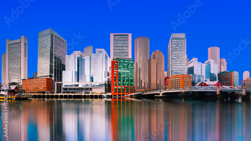 Boston City Skyline, skyscrapers and water reflections on the Charles River with the Blue Sky backgrounds in Massachusetts, USA