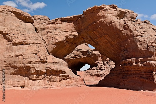 View of the Arch of Bouhadian rock formation, Tadrart rouge, Tassili n'Ajjer National Park, Unesco World Heritage Site, Sahara, Algeria, Africa. photo