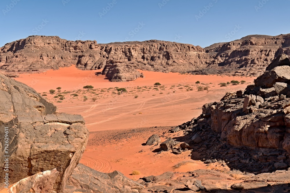 Fototapeta premium Bouhadian rock formations in Tadrart Rouge, Tassili N'Ajjer National Park. Sahara, Algeria, Africa.