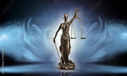 No law concept.  Bronze Statue of Justice in smoke photo