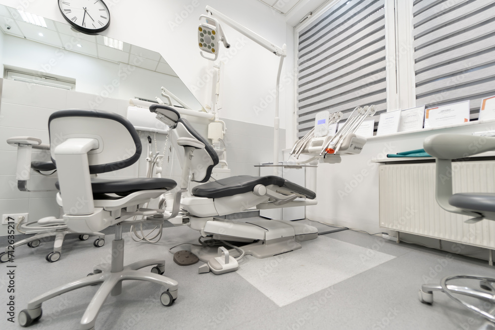 Specialized medical dental equipment for the treatment of patients in a private dental office. A dental chair in the dentist's office of a dental clinic.