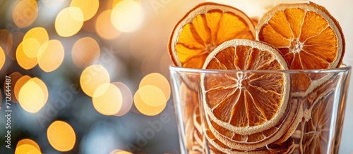 Dried orange slices and wedges in a vase, used for Christmas decor and added to drinks and baked goods.