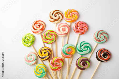 Set of colored caramel candies on sticks lollipop swirl