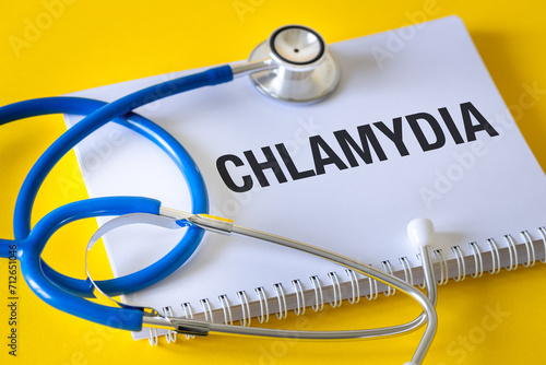 Chlamydia (Chlamydia Trachomatis) Conceptual word Chlamydia in doctor's notebook. Health concept, Bacteria causing urinary tract infection, Sexually transmitted disease, doctor stethoscope  photo