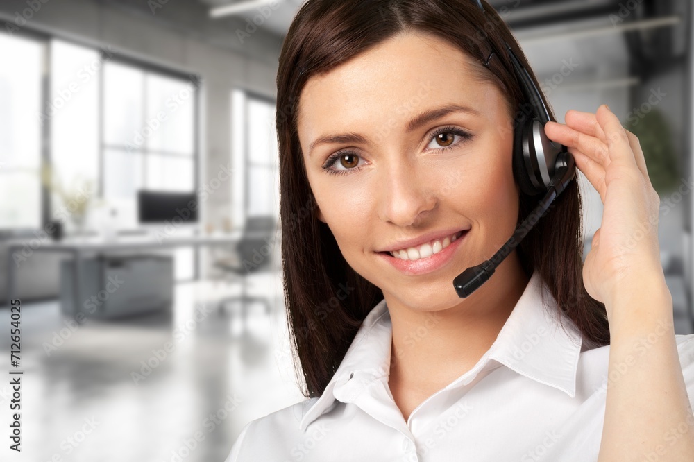 Happy professional business woman using headset Happy professional business woman using headset
