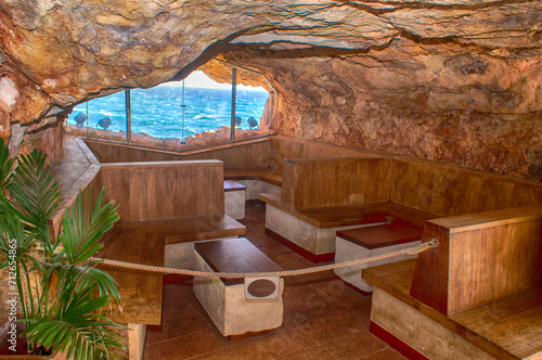 Xoroi caves by the sea, leisure place in Menorca. photo