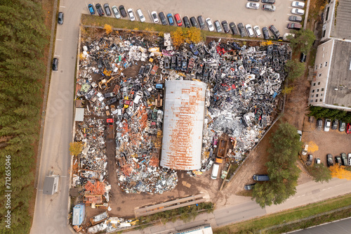 Drone photography of metal recycling facility and storage place during autumn day