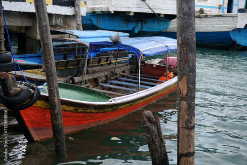 several parked dinghies commonly used for sea and river transportation or fishing