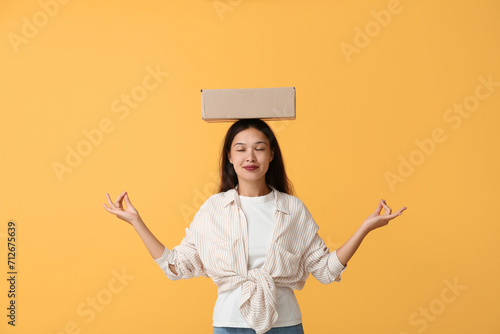 Pretty young woman meditati...
