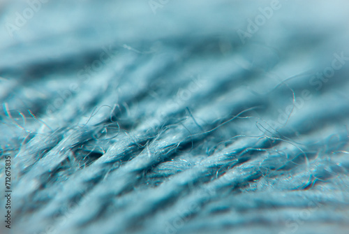 Close-Up View of Blue Fabric Threads in Detailed Texture Exploration