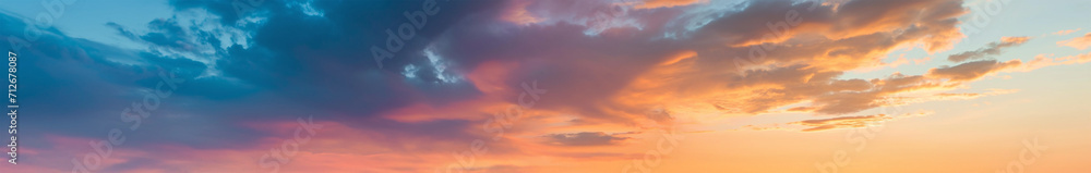extra wide panoramic sunset sky. Vibrant gradient tones. poster banner landing page background design. Vibrant fantasy colorful cloudscape. Orange with red with yellow with blue, with purple