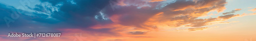 extra wide panoramic sunset sky. Vibrant gradient tones. poster banner landing page background design. Vibrant fantasy colorful cloudscape. Orange with red with yellow with blue, with purple © ana