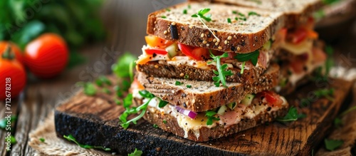 Nourishing sandwiches with creamy cheese and fresh veggies on crunchy rye bread.