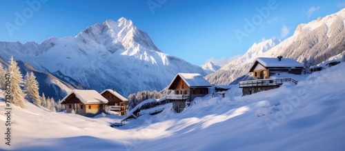 Snow-covered ski huts in a winter landscape. Alpine cabins in Aosta Valley Monterosa Gressoney.