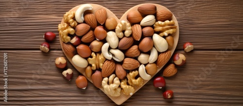 Heart-healthy nuts: heart-shaped hazelnuts and a variety of other nuts.