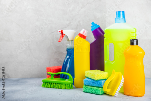 Cleaning service concept.Home cleaning product on a light background. Bucket with household chemicals. cleaning supplies for home or office space.Early spring regular cleaning. Copy space