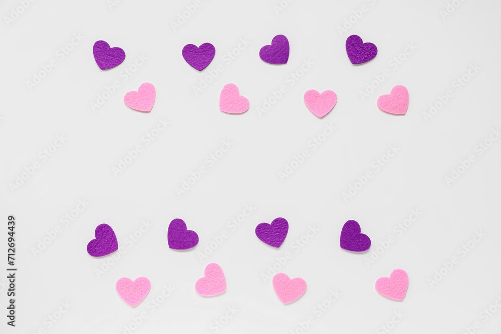 Frame made of beautiful hearts on white background. Valentine's day celebration