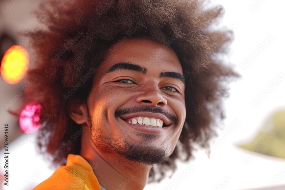 A man with an afro and a beard is smiling A man with an afro and a beard is smiling
