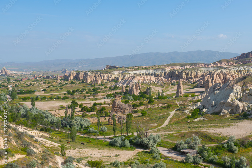 Fairy chimneys aerial view in Goreme Historic National Park in Cappadocia, Central Anatolia, Nevsehir Province, Turkey. Goreme Historic National Park is a UNESCO World Heritage Site since 1985. 