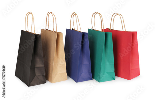 Many paper shopping bags on light background