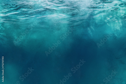 Underwater view of clear blue ocean with light rays.