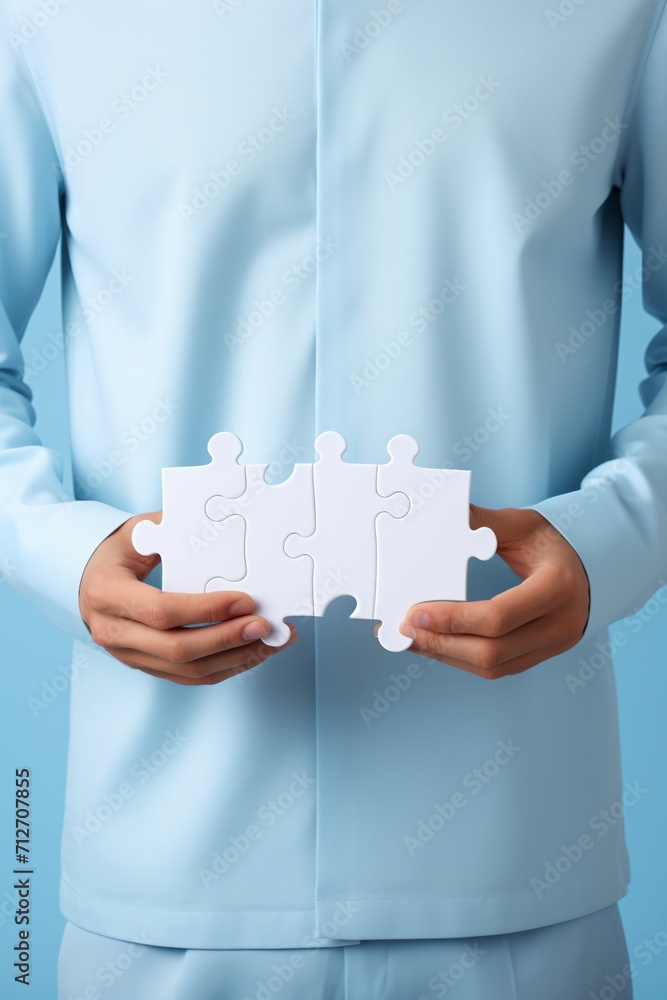 Man in blue holding puzzle pieces, Man in blue holding puzzle pieces,
